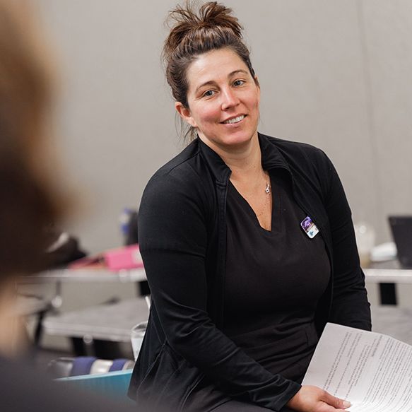 grabber instructor smiling at student