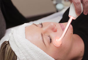 Woman Getting Facial Treatment