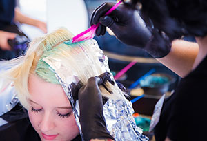 Woman Getting Hair Colored at Salon