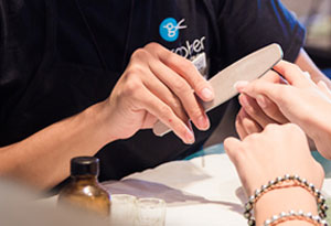 Woman Getting Nails Filed