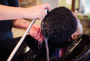 Woman Getting Hair Shampooed at Salon
